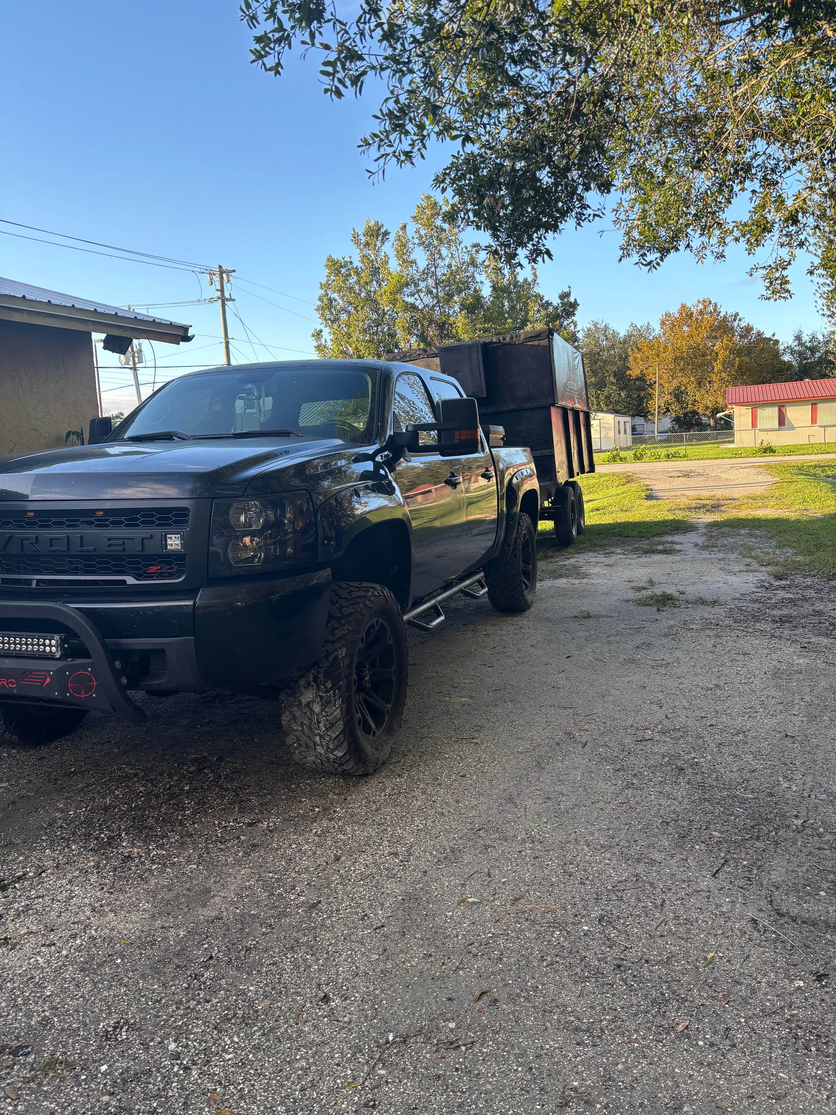Black pickup truck — hauling junk across South Florida