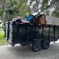 Dump trailer loaded with debris — no load too heavy